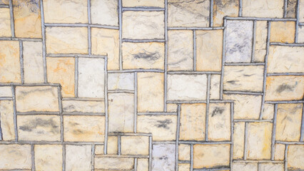 background with stone block structure, wall of stone blocks and concrete joints