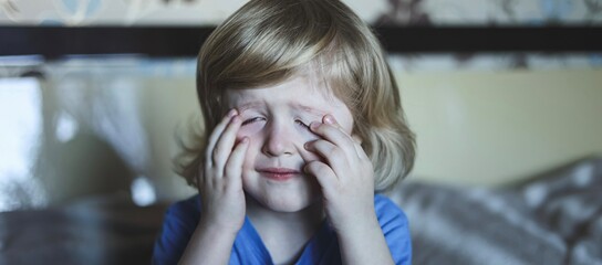 Cute five years old blonde boy with blue eyes and different emotions facial expression. Portrait. Emotions on the face of baby. Banner.