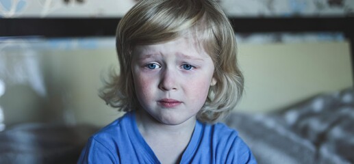 Cute five years old blonde boy with blue eyes and different emotions facial expression. Portrait....
