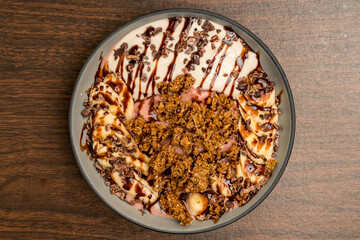Smoothie bowl with granola and bananas