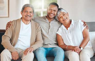 Family, face and happiness in living room on sofa for bonding, relax and visit together on weekend. Parents, man and portrait with smile in house on couch for love, care and relationship support