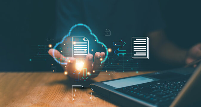 Document Management System (DMS) technology. Database storage and file data transfer sharing by cloud computing system. Businessman holding cloud icon and use laptop for connect network data.