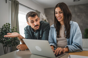 Adult woman work from home while her boyfriend hug and stand with her