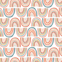 Childish seamless pattern with hand drawn rainbow, hearts and dots. Trendy kids vector background.