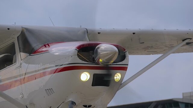 Floatplane, seaplane - light utility aircraft with floats and spinning propeller at the airshow, exhibition at the Istanbul airport in Turkey: close up, slow motion. Transportation and tourism concept