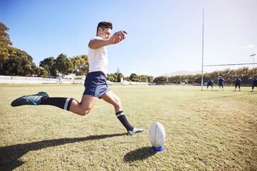 Rugby, action and man kick ball on field for match, tournament or conversion training. Fitness, sports and male athlete with motion for technique, challenge or score between goal post in game