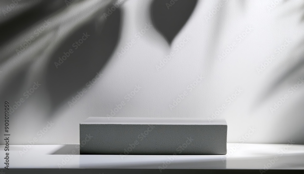 Poster minimal abstract background for product presentation, grey square podium with shadow and leaf silhou