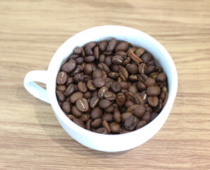 Coffee beans in a coffee cup