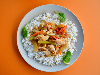 Chicken Szechuan with long grain steamed rice and baby spinach leaves.