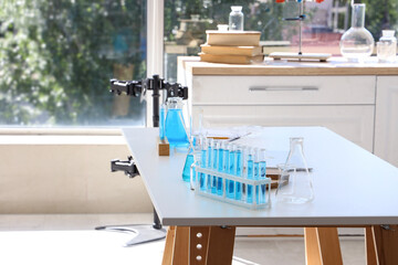 Chemical glassware on table in laboratory