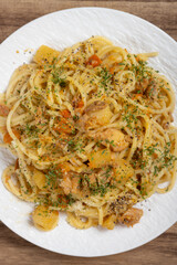 top view spaghetti with chicken and potato curry sauce at vertical composition