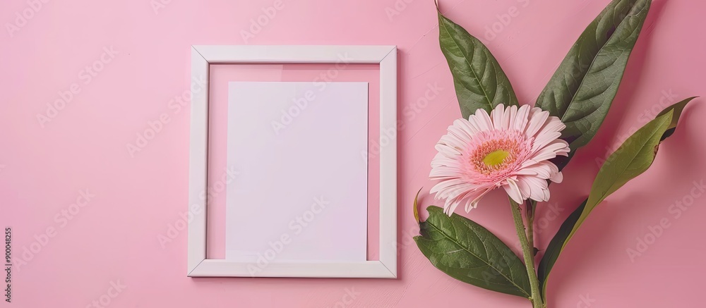 Poster Flat lay mockup featuring a photo frame and a flower with space for a picture. with copy space image. Place for adding text or design