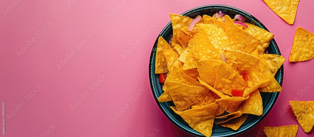 Poster nacho bowl on vibrant backdrop with copy space image