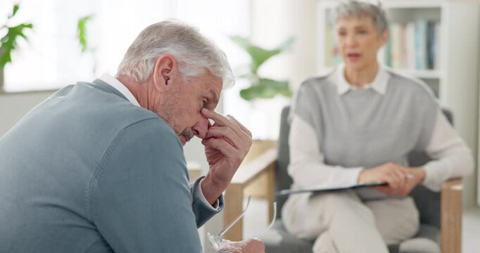Senior, man and sad in consultation for therapy, counseling and emotional support for coping with grief or loss. Elderly man, psychologist and conversation for bereavement, healing and mental health.