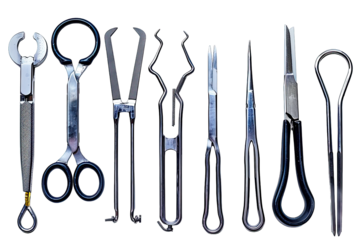 A collection of surgical instruments neatly arranged in a row. Ideal for medical, hospital, and healthcare themes.