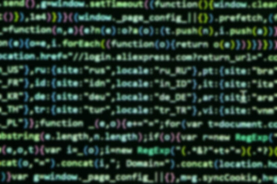 Blurry unfocused programming coding screen, web developer coding screen