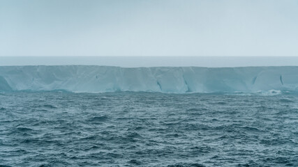 A23a Incredible Iceberg Antarctica Rough Seas Moody Clouds Fog and Dark Ocean. Ice Shelf Climate...