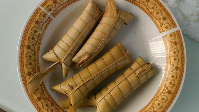 Sticky rice lepet food or Lepet ketan on a plate seen from above, traditional food from Indonesia