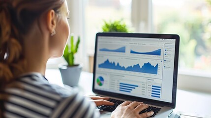 A digital marketer using analytics software to track campaign performance