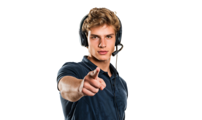 Portrait of a young male call center agent wearing headphones and pointing his index finger, isolated on transparent background
