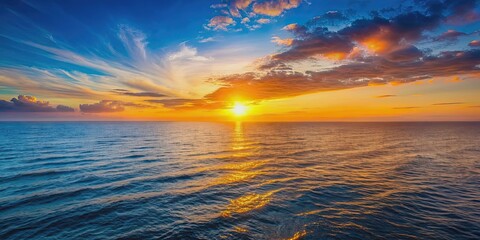 Obraz premium Sun setting over ocean horizon at sunset, sunset, sun, orange, sky, ocean, horizon, dusk, peaceful, tranquil, nature