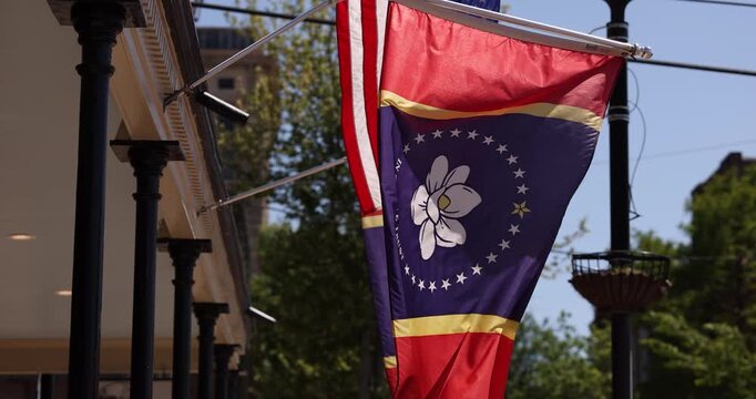 Vicksburg, Mississippi, USA - April 23, 2024: The newly designed Mississippi state flag hangs in historic downtown.