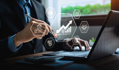 Property management and real estate investment and financial growth. Businessman using digital...