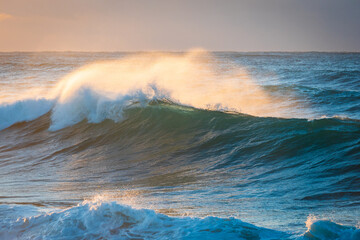 Breaking wave with offshore wind in the morning.