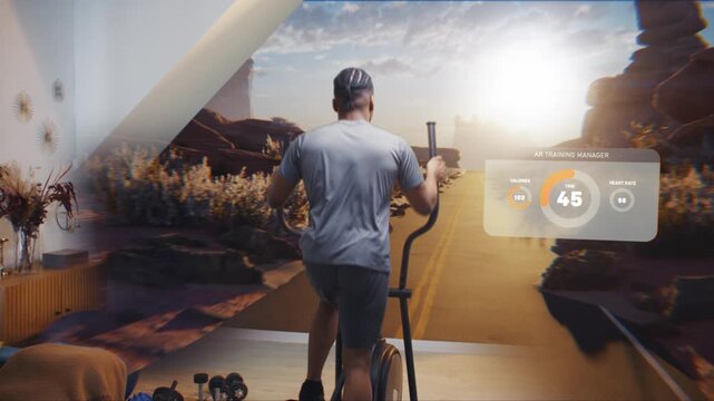 African American athletic man in virtual reality headset exercises on orbitrek. VR screen shows landscape and AR training manager with timer and health care statistics. Metaverse futuristic home gym. - Powered by Adobe