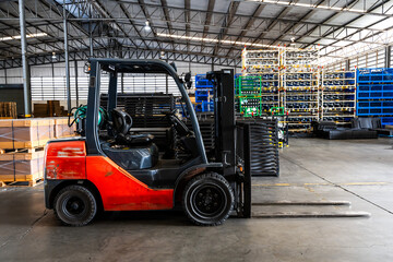 Empty forklift parking in distribution warehouse