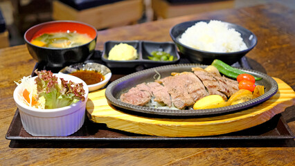 Japanese food sliced teppanyaki set dinner meal with soup, potato, salad, rice