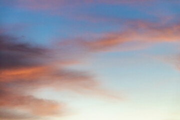 Cotton candy clouds in the sky at sunset.