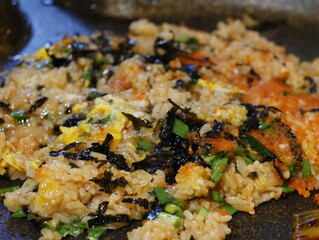 Korean fried rice after barbeque on the grill. Crispy bokkeumbob, crunchy rice with vegetables.