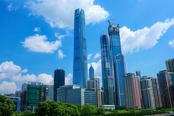 Fototapeta premium Skyscrapers Viewed from Below with Blue Sky and White Clouds