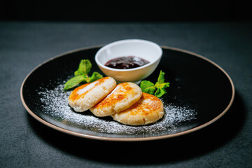 Cottage cheese pancakes with raspberries and blueberry Jam.