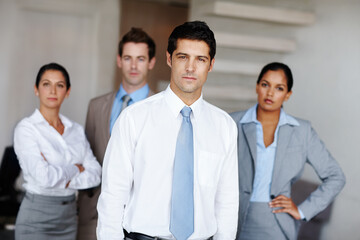 Man, corporate and portrait or serious in office, business and company pride with employees in...