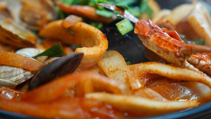 Food made with a lot of seafood such as squid and crab