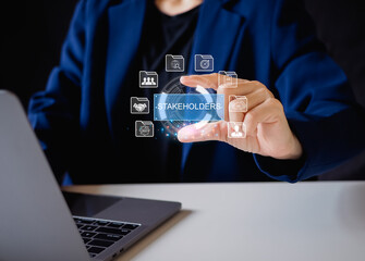 Stakeholders concept. Person touching stakeholders icon on virtual screen for business finance stakeholder investment management. Different stakeholders contact collaboration for company organization