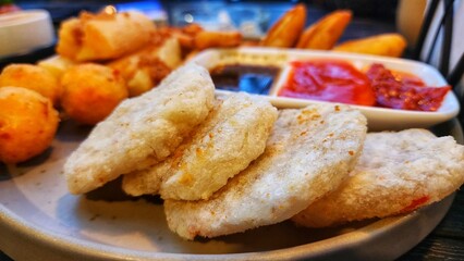 Fried fish and chips on a plate. Fried fish and chips on a plate