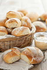 healthy bread,  A rustic basket filled with warm, sugar-free bread rolls, placed on a wooden table next to a small jar of homemade spread, capturing a cozy mealtime scene perfect