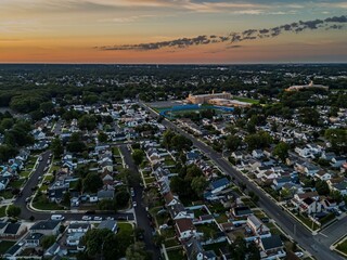 Aerial view of a residential neighborhood in Valley Stream at sunset in Long Island, New York, USA