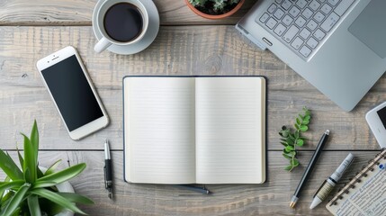 A laptop and a cell phone are on a table with a notebook and a cup of coffee