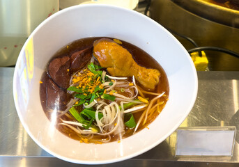 Thai soup with meat in a plate