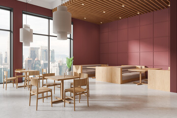 Red cafeteria interior with eating tables and soft place, panoramic window