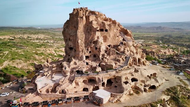 Drone footage of the Uchisar Castle on a sunny day in Uchisar town in NevsehirCappadocia, Turkey