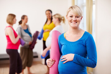 Pregnant, yoga and portrait of woman in class for prenatal exercise, development and self care. Happy, pregnancy and female person with mat at session for health, wellness and preparation for labor