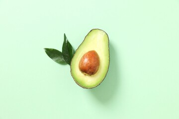 Green avocado on a color background 