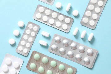 Pills in blisters on a colored background