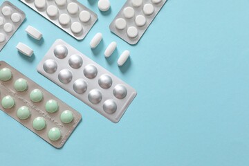 Pills in blisters on a colored background