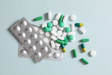 Different pills on a color background